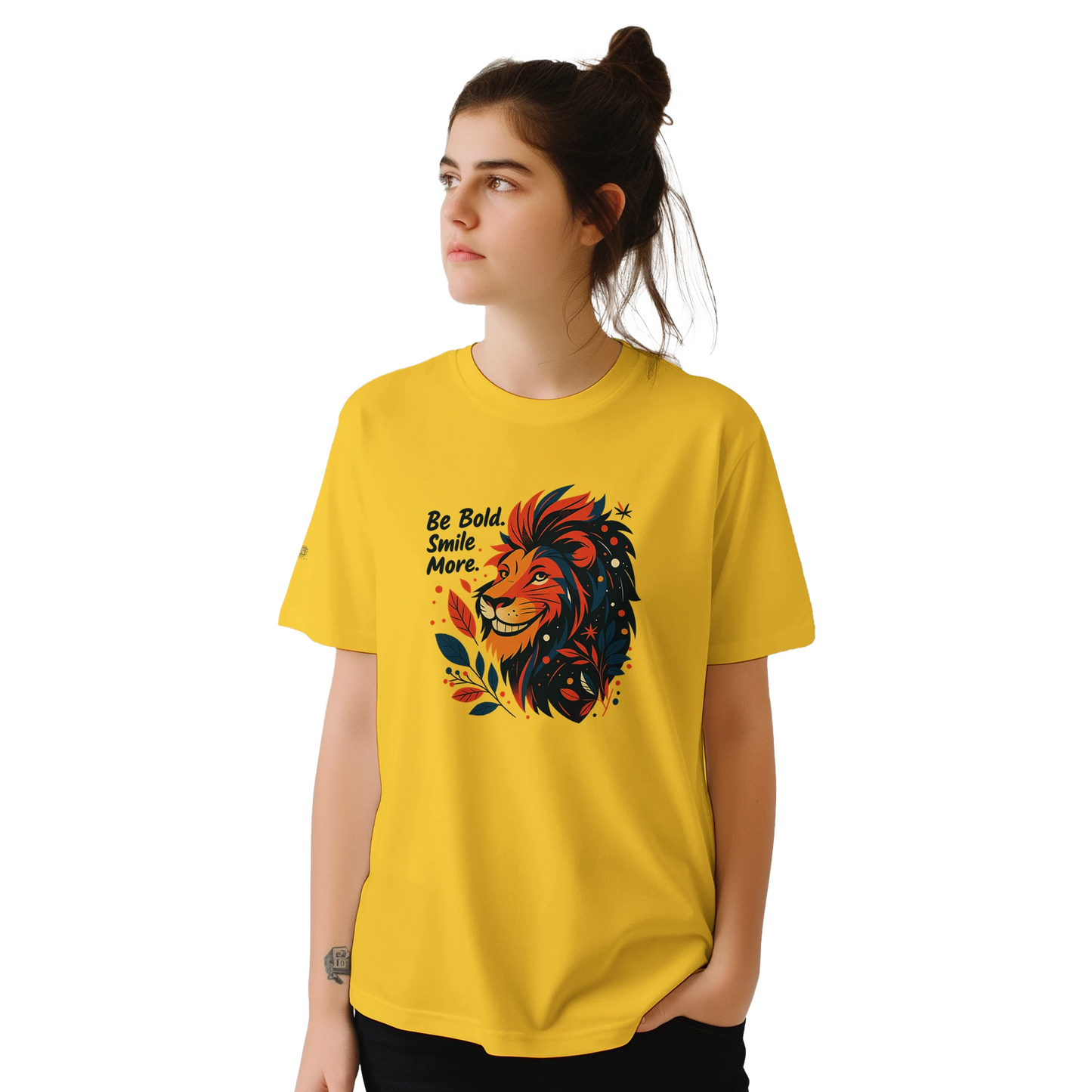 Female model wearing a yellow T-shirt with a lion illustration and slogan “Be Bold Stay Strong,” front view.
