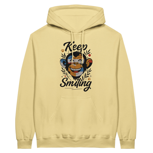 Yellow hoodie featuring playful monkey design and positive text.