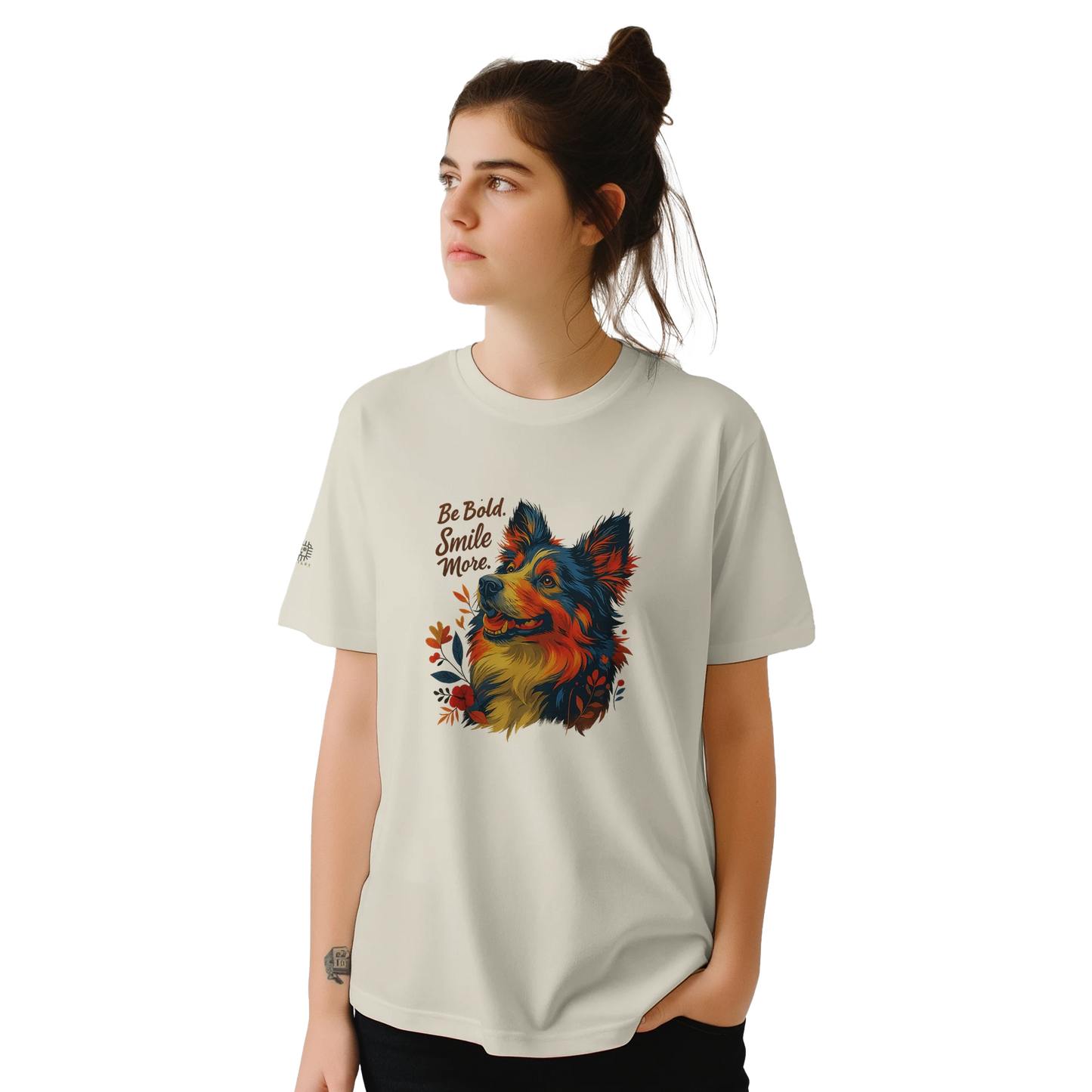 White T-shirt – White unisex artistic T-shirt featuring a vibrant multicolor dog portrait with flowers and the uplifting slogan “Be Bold, Smile More.” Inspirational graphic tee for everyday wear.