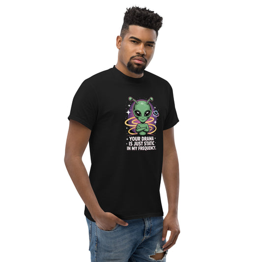 Male model wearing black T-shirt — front print: green alien with colorful background and text YOUR DRAMA IS NOT SPEAKING MY FREQUENCY