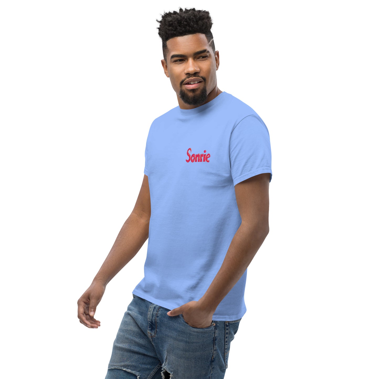 Male model wearing a light blue T-shirt with Sonrie text on the chest