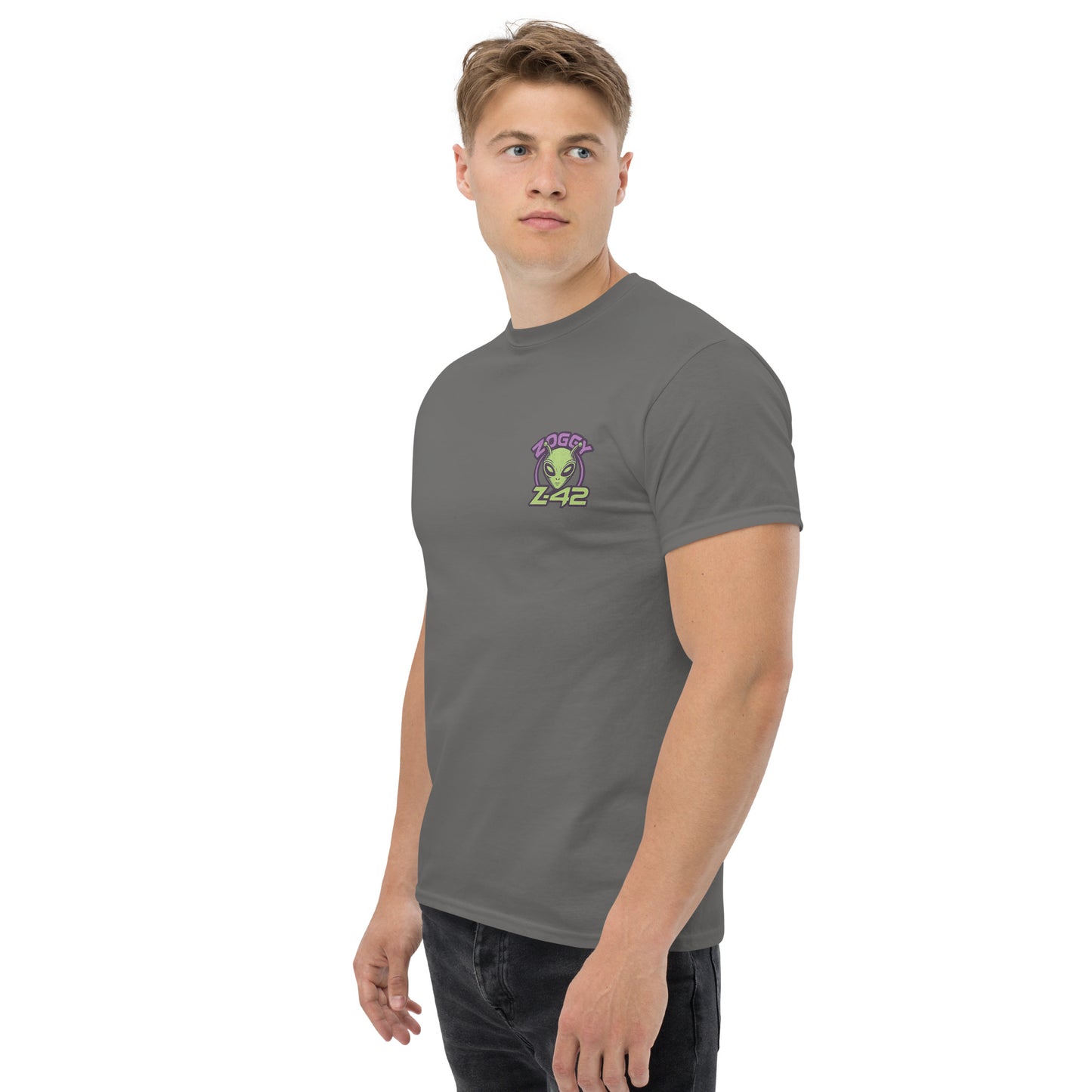 Male model wearing grey T-shirt — front left chest small alien in spaceship graphic