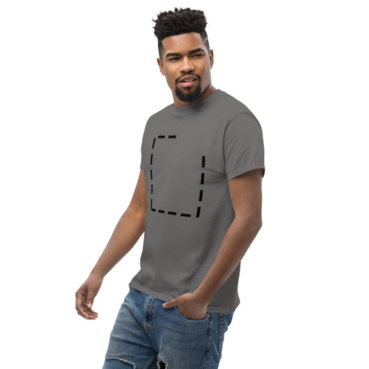 Front view of the grey t-shirt worn by a model. The shifted dashed square remains clearly visible, while the relaxed fit keeps the composition balanced and understated.