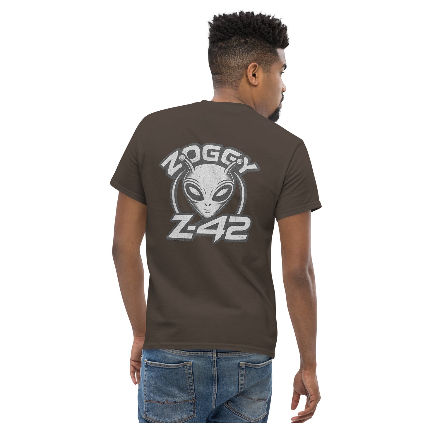 Male model wearing brown T-shirt — back print: large grey alien head with text ZOGGY Z-42