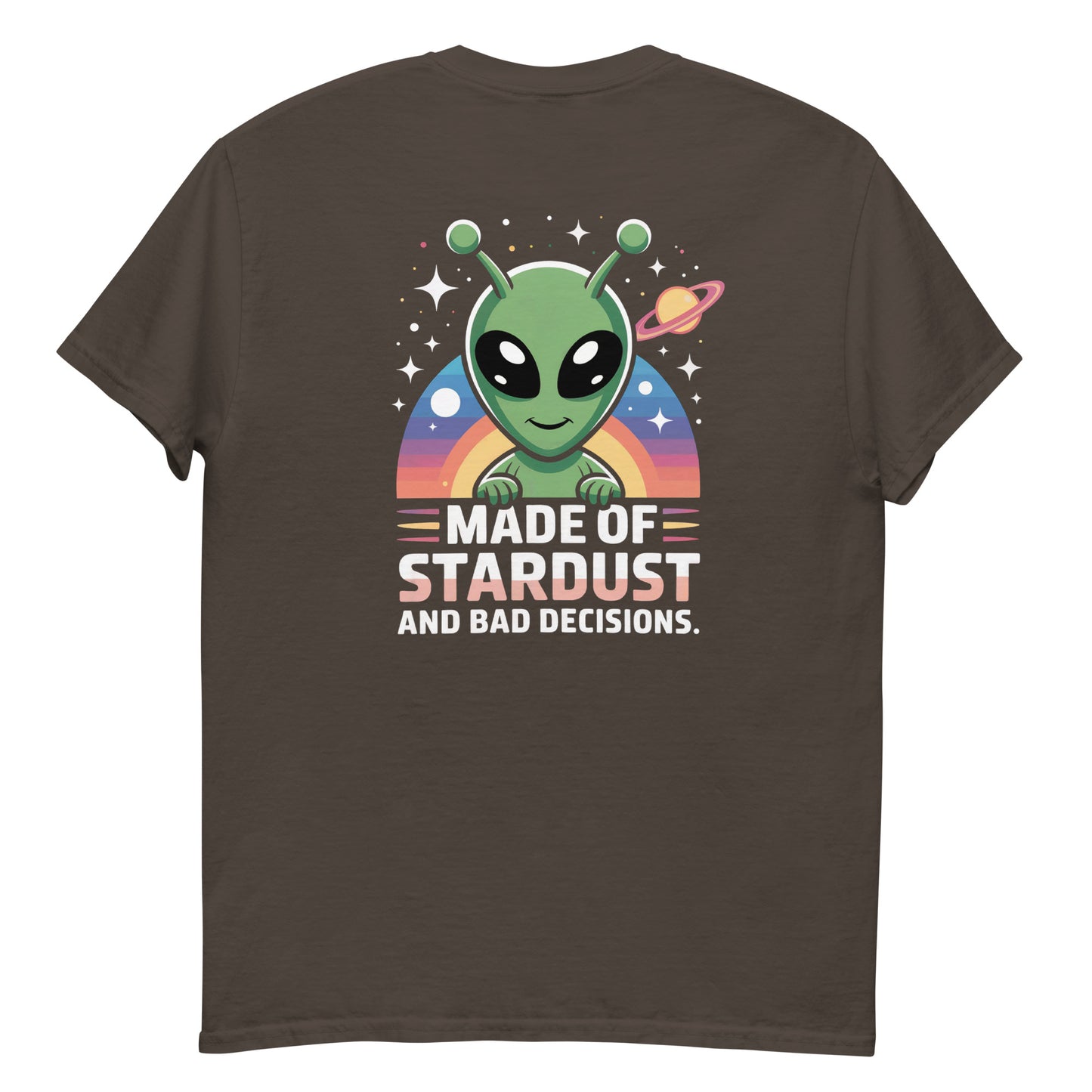 Male model wearing brown T-shirt — back print: green alien with planets and text MADE OF STARDUST AND BAD DECISIONS
