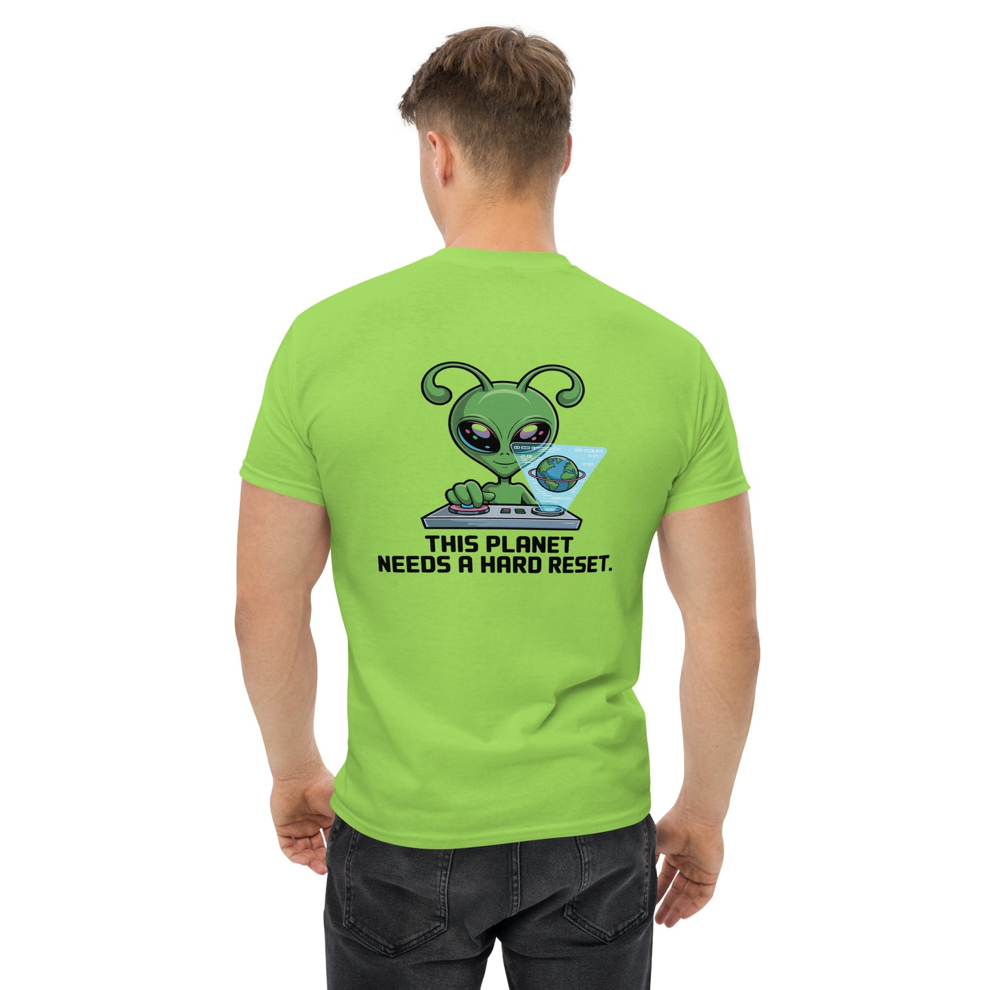 Male model wearing light green T-shirt — front left chest small alien head graphic