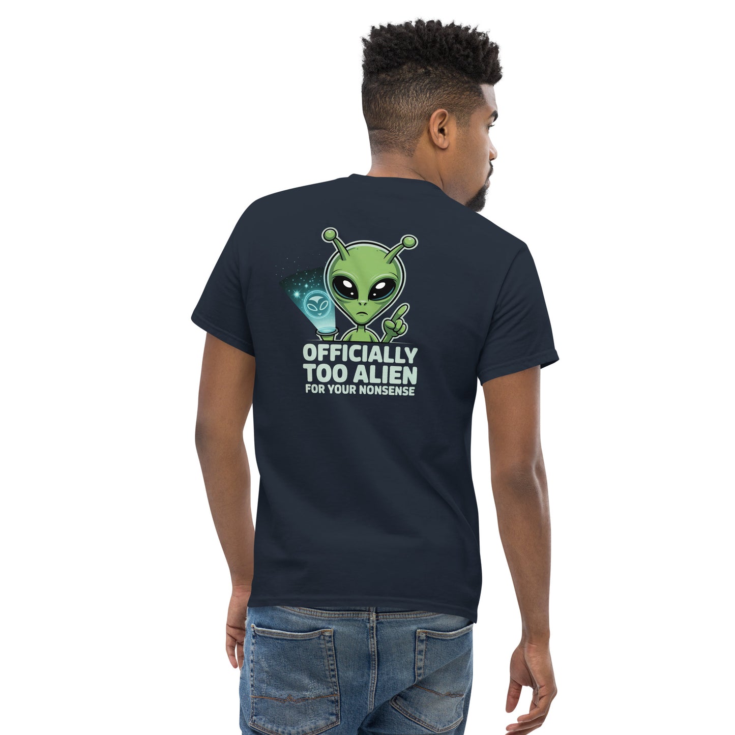 Male model wearing navy blue T-shirt — back print: green alien with text OFFICIALLY TOO ALIEN FOR YOU HUMANS