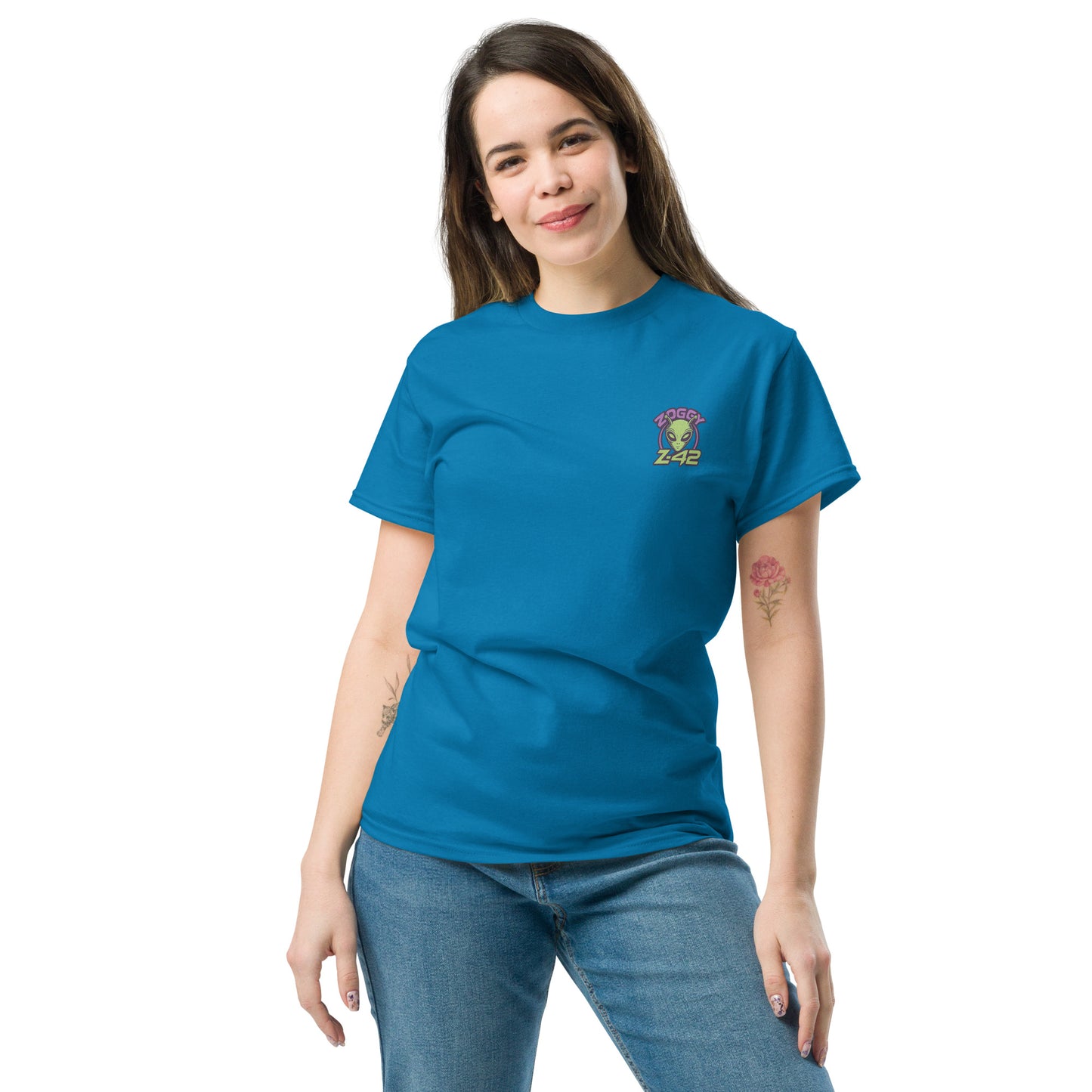Female model wearing blue T-shirt — front left chest small alien head graphic