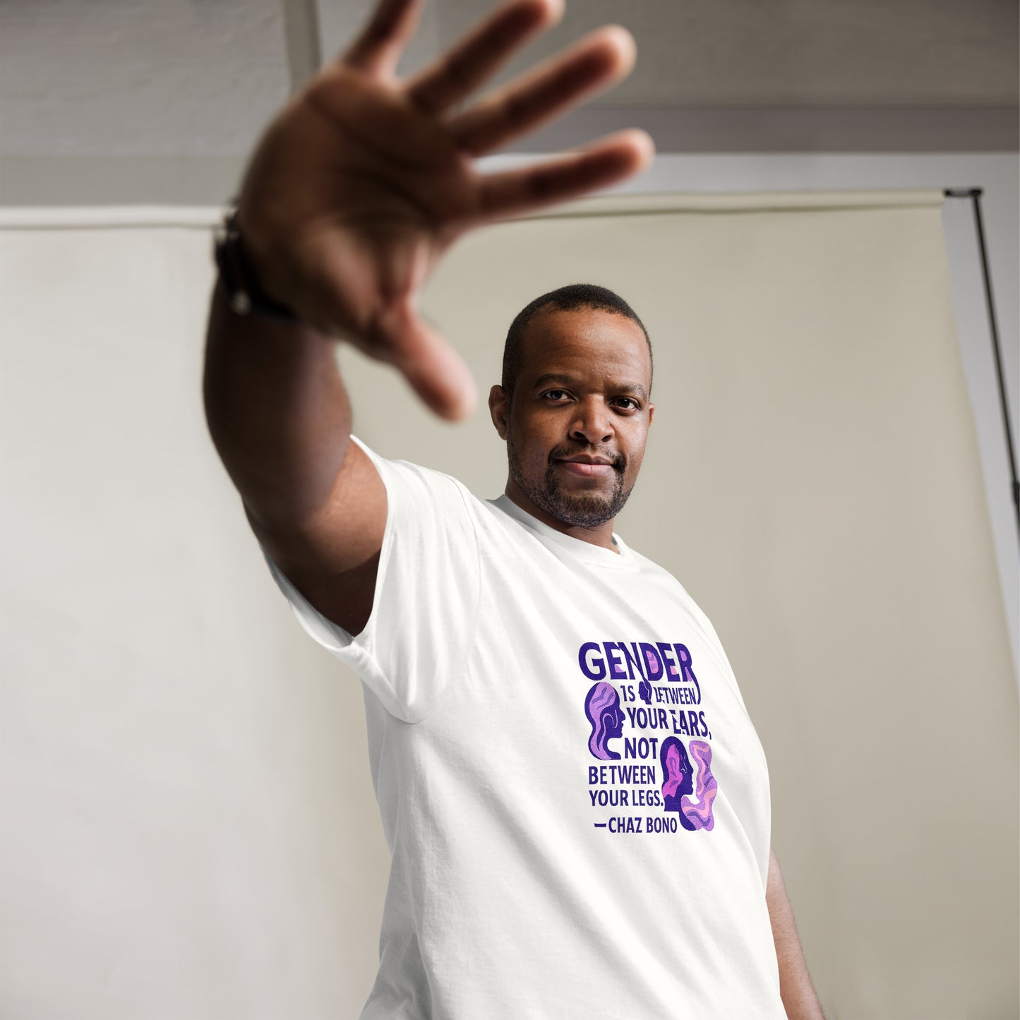 Man wearing white t-shirt with bold purple feminist quote print – Sisterhood Club Collection