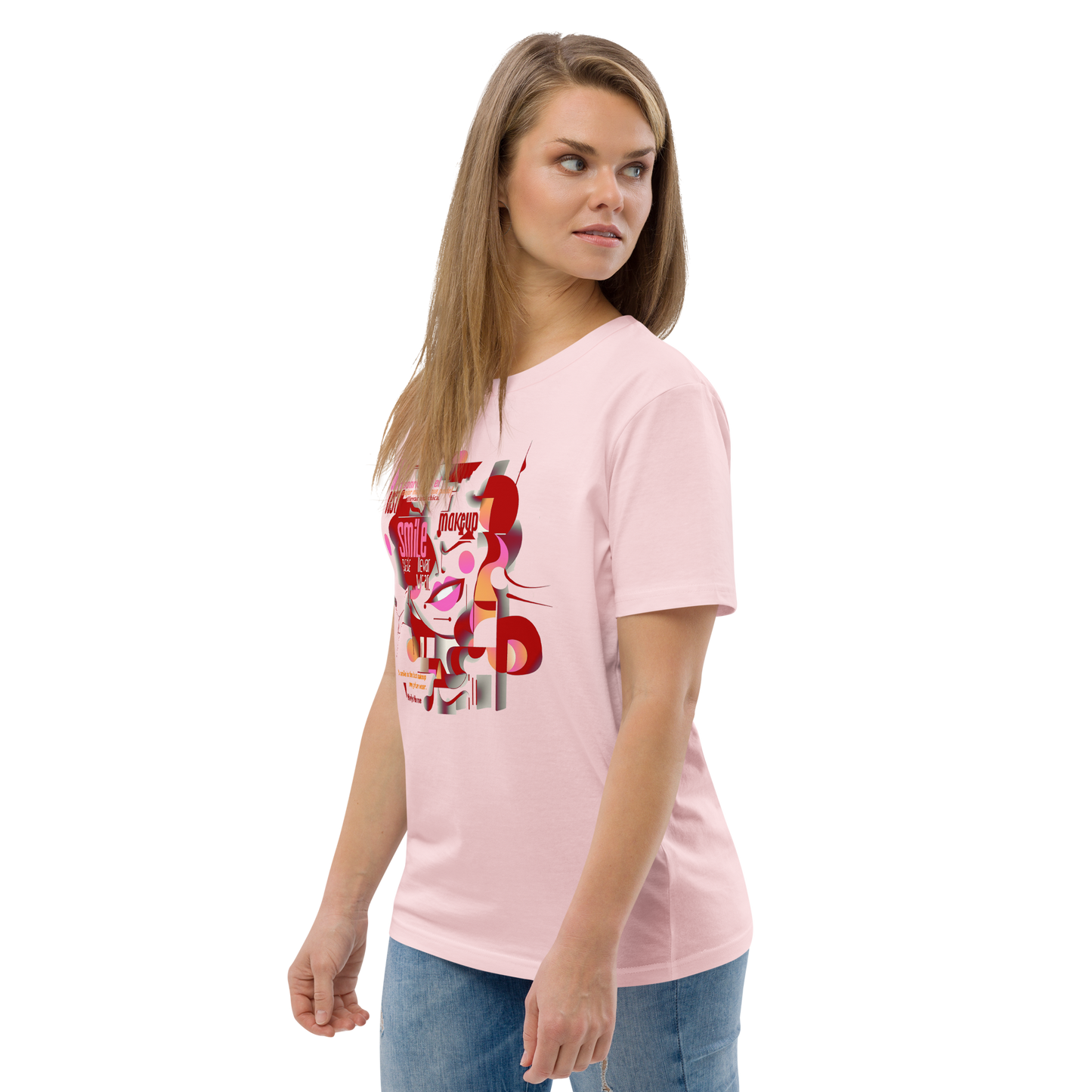 Female model wearing peach T-shirt — front print: abstract Marilyn Monroe portrait with quote “A smile is the best makeup any girl can wear. — Marilyn Monroe”