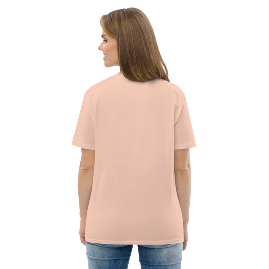 Female model wearing peach T-shirt — back view, blank