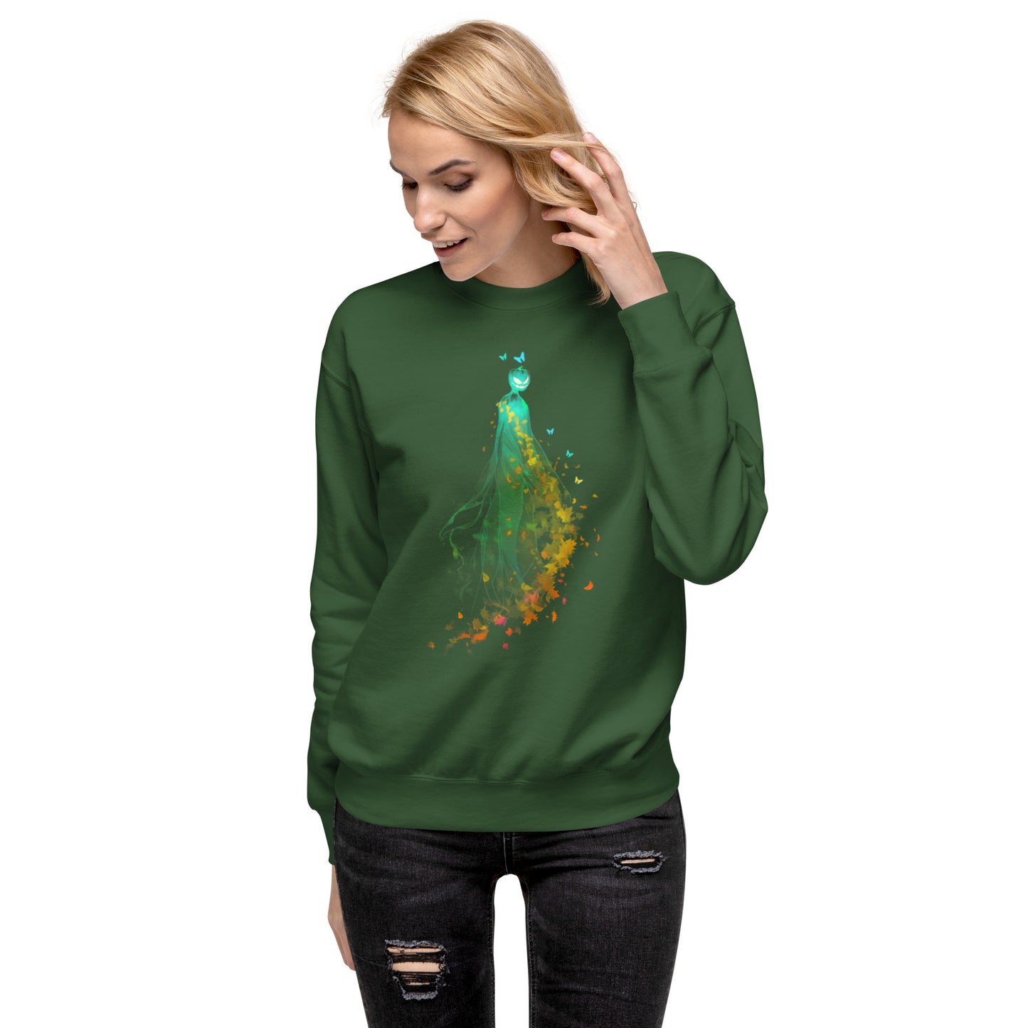 Woman wearing green sweatshirt with pumpkin spirit and autumn leaves Halloween design.