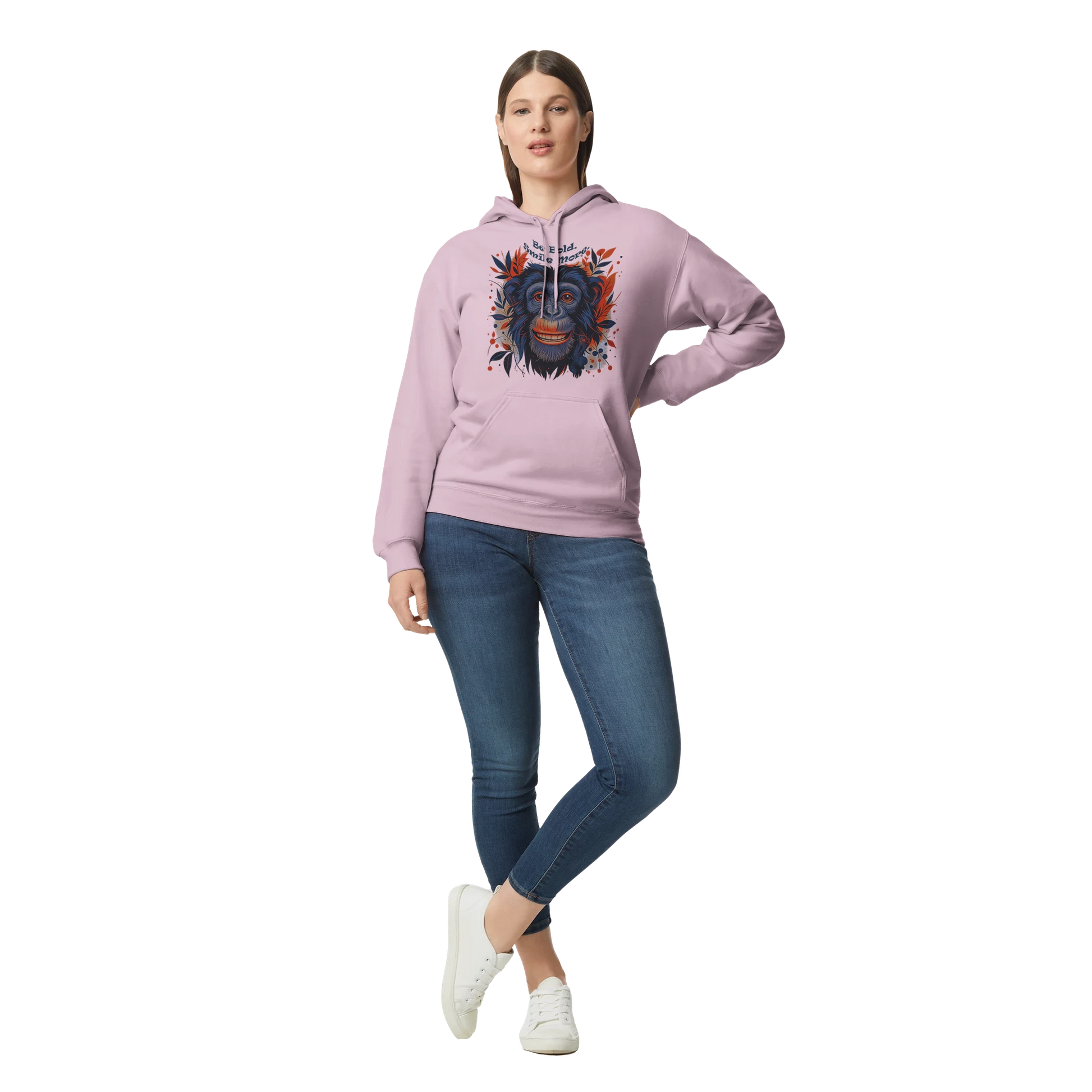 Female model wearing pink hoodie with chimpanzee artwork, front view.