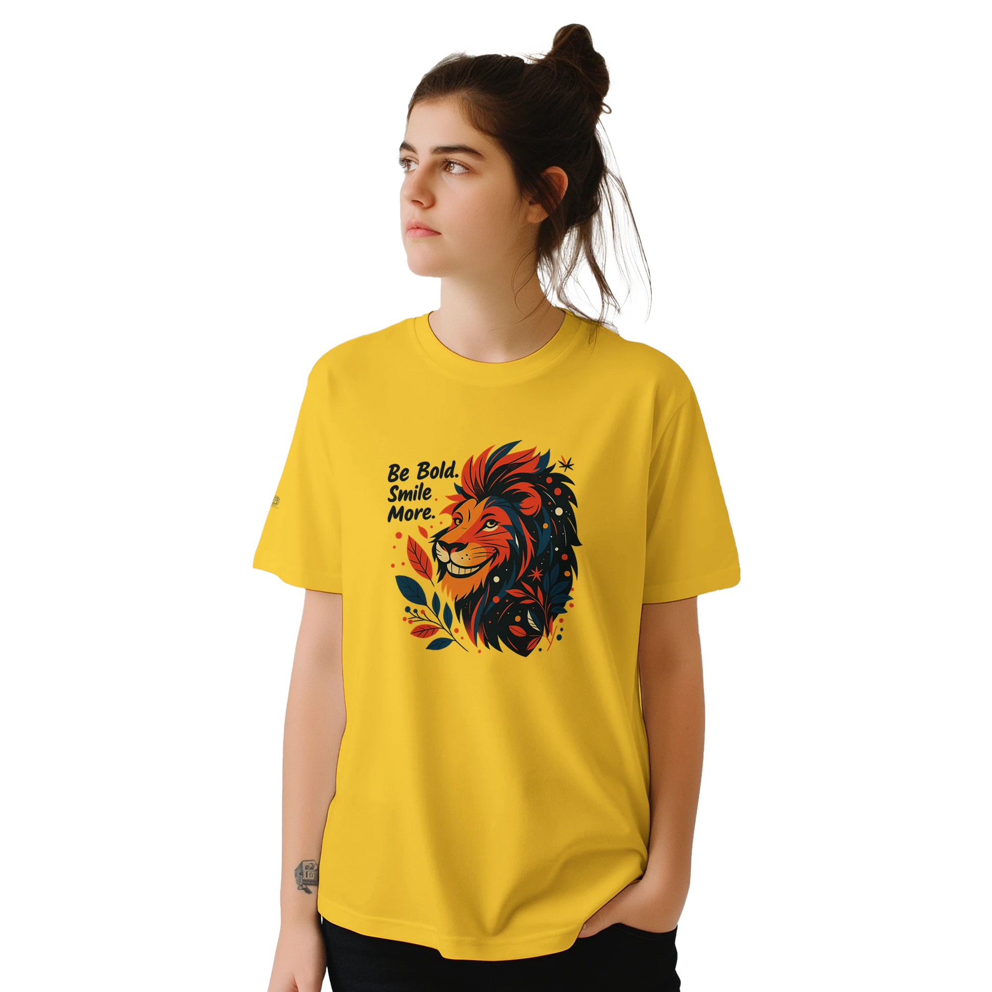 Female model wearing a yellow T-shirt with a lion illustration and slogan “Be Bold Stay Strong,” front view.