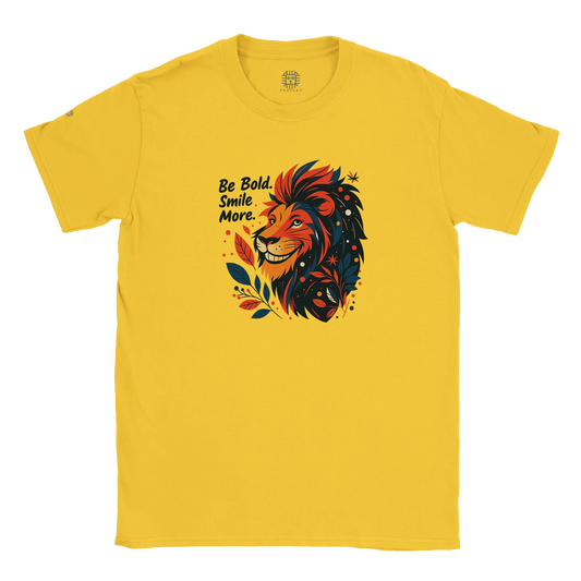 Yellow unisex T-shirt with a bold lion illustration and slogan “Be Bold Stay Strong,” displayed flat.