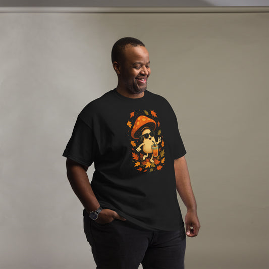 Black T-shirt on male model (standing, studio light) – autumn mushroom design printed on the chest.