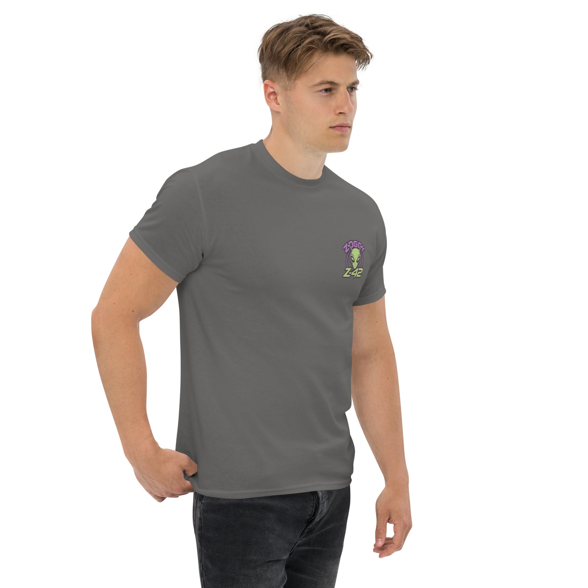 Male model wearing grey T-shirt — front left chest small alien in spaceship graphic