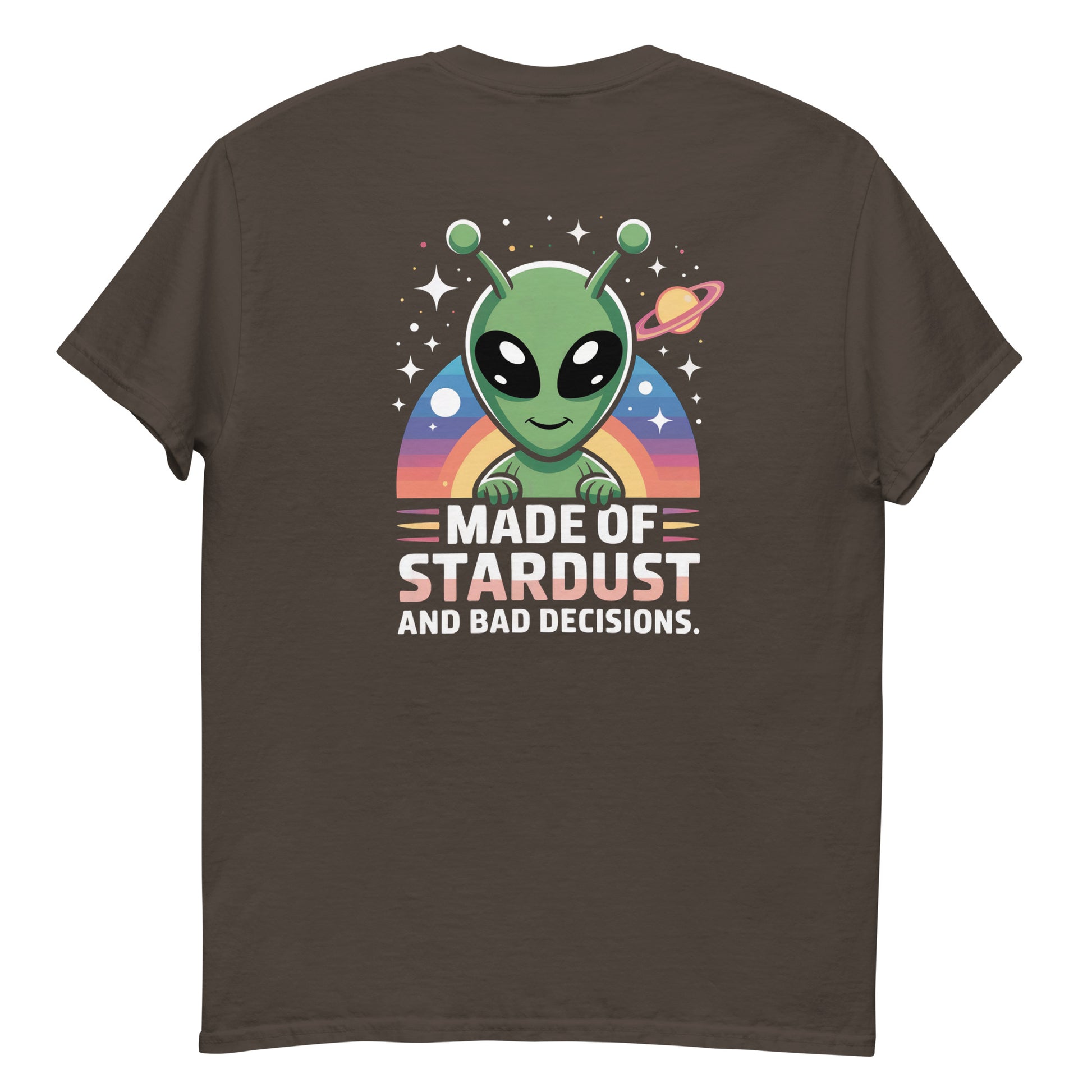 Male model wearing brown T-shirt — back print: green alien with planets and text MADE OF STARDUST AND BAD DECISIONS