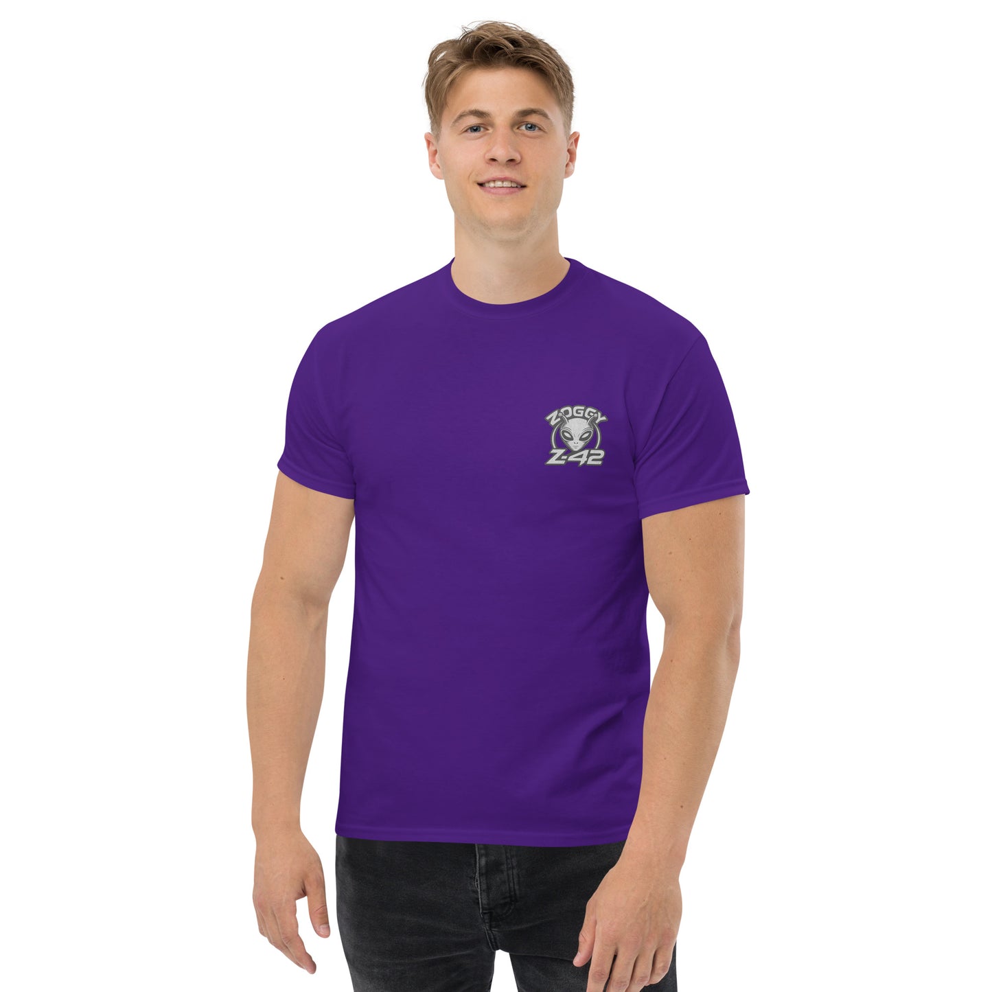 Male model wearing purple T-shirt — back print: green alien in floral frame with text ALIEN HEART