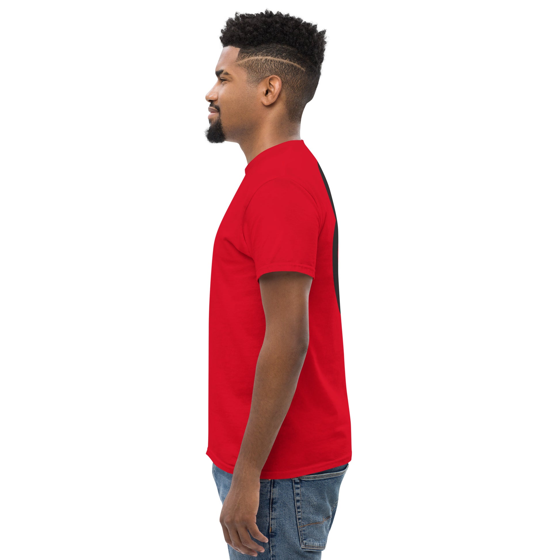 Three-quarter view of the model wearing the red t-shirt. The back graphic remains partially visible, emphasizing the scale and placement of the design in relation to the shoulder line.