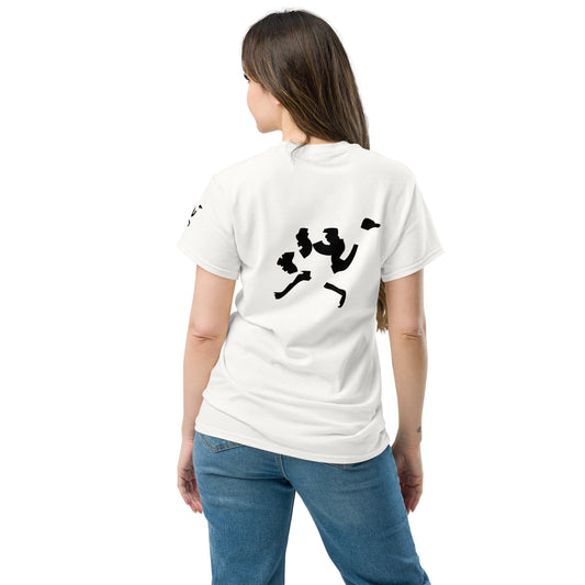 Back view of a white minimalist t-shirt worn by a female model, featuring a black abstract fragmented graphic on the upper back. Modern graphic t-shirt with clean composition and high-contrast print.