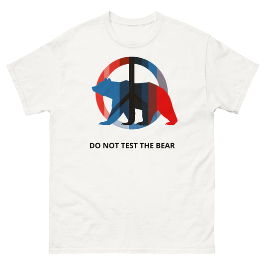 White t-shirt featuring a bold political graphic with the statement “DO NOT TEST THE BEAR.”
The composition combines a simplified bear form with red and blue geometric elements, creating a visual tension between restraint and warning.
The design communicates controlled strength and clear boundaries rather than aggression.