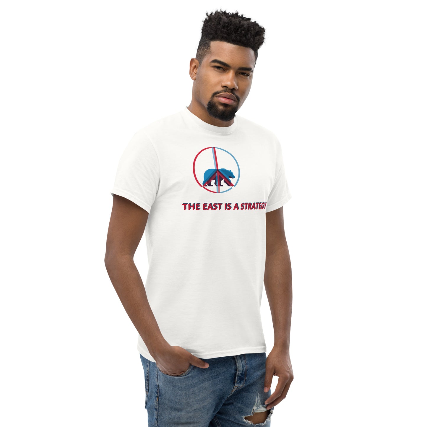 Model wearing a white graphic t-shirt with the “THE EAST IS A STRATEGY” statement.
The centered front print remains clear and balanced, reinforcing a calm, controlled visual message within a clean silhouette.