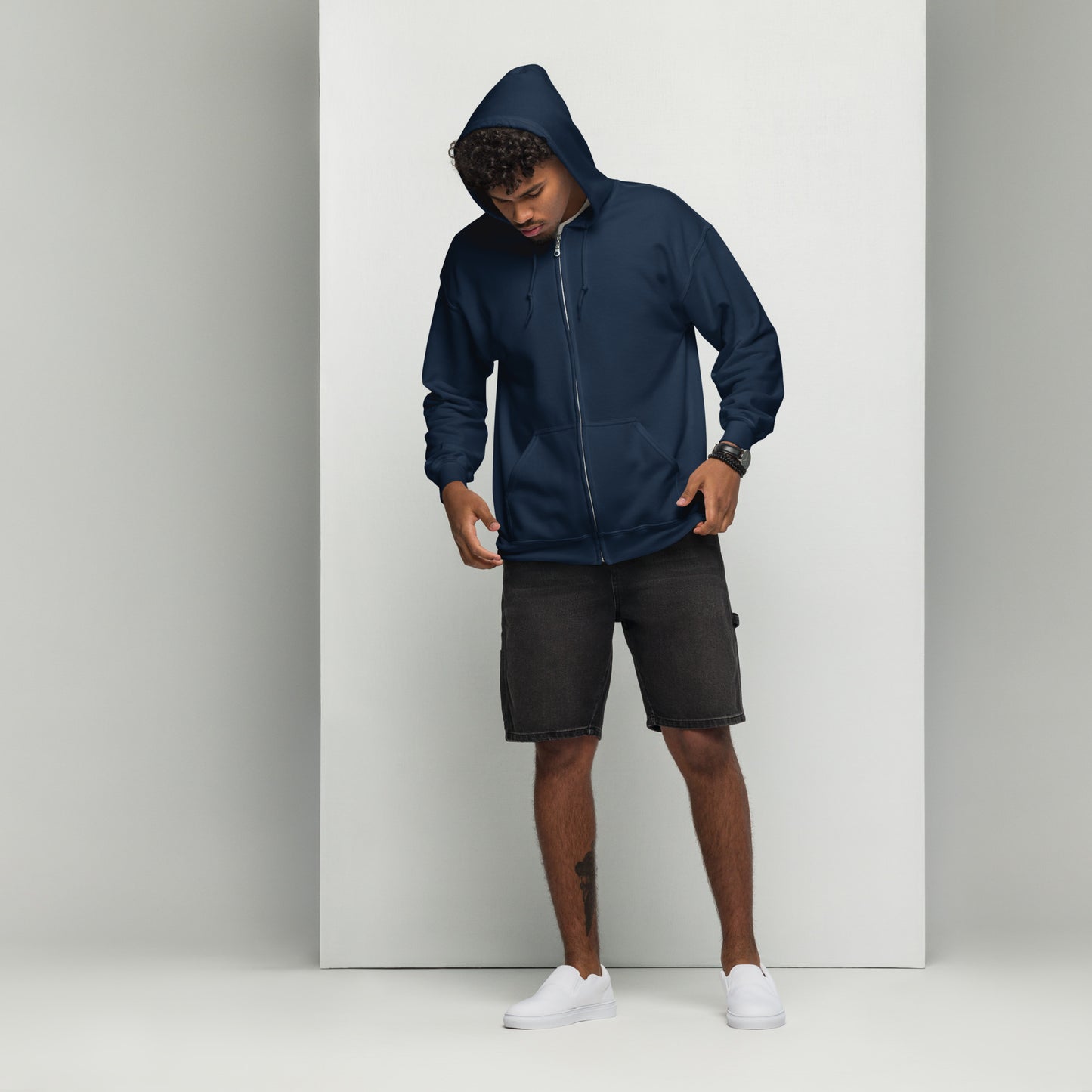 Front view of a navy unisex zip hoodie with hood up, full-length zipper, and clean minimalist front.