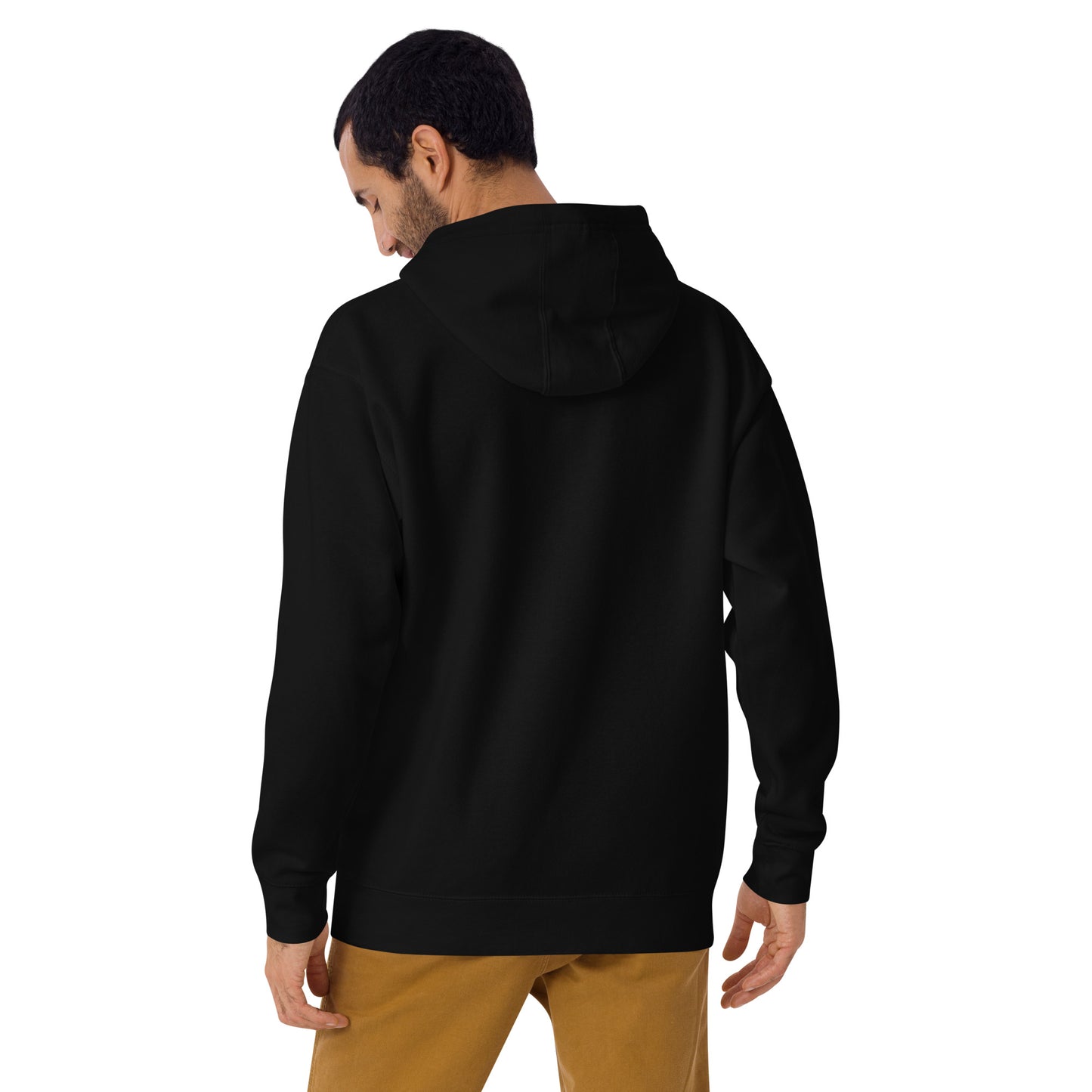 Back view of a black unisex hoodie worn by a model, showcasing the relaxed fit, hood design, and minimalist streetwear silhouette.