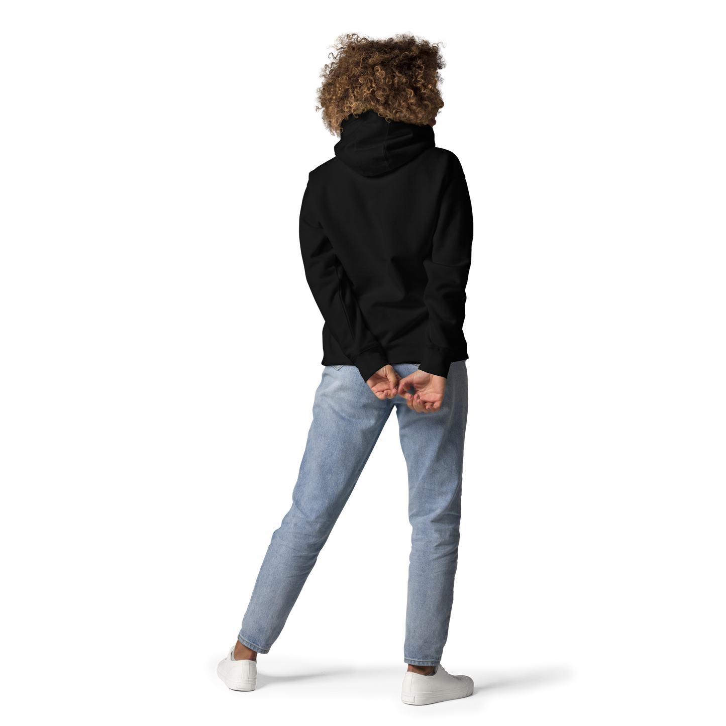 Back view of a black unisex hoodie worn by a model, showcasing the relaxed fit, hood design, and modern streetwear silhouette.