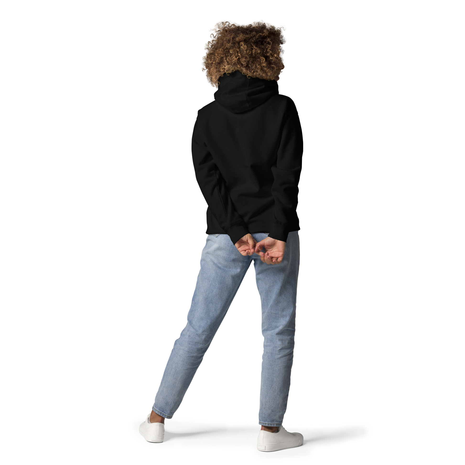 Back view of a black unisex hoodie worn by a model, showcasing the relaxed fit, hood design, and modern streetwear silhouette.