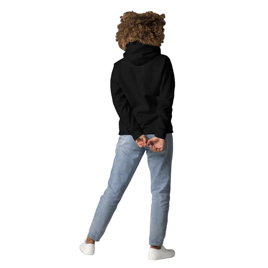 Back view of a black unisex hoodie worn by a model, showcasing the relaxed fit, hood design, and modern streetwear silhouette.