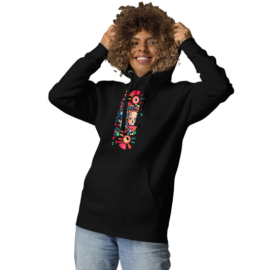 Woman wearing a black unisex hoodie featuring a colorful Japanese pop art graphic with a playful character, vinyl-inspired elements, and vibrant geometric details from the Japan Pop Chaos collection.