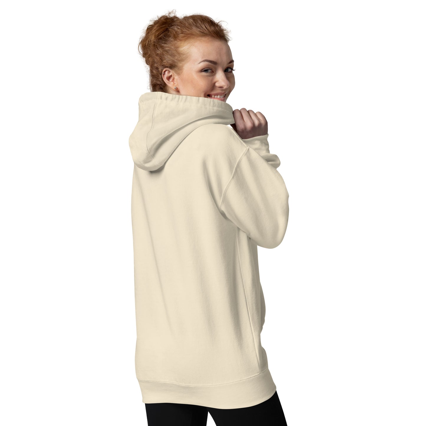 Back view of a cream unisex hoodie worn by a model, highlighting the relaxed fit, hood construction, and minimalist casual silhouette.