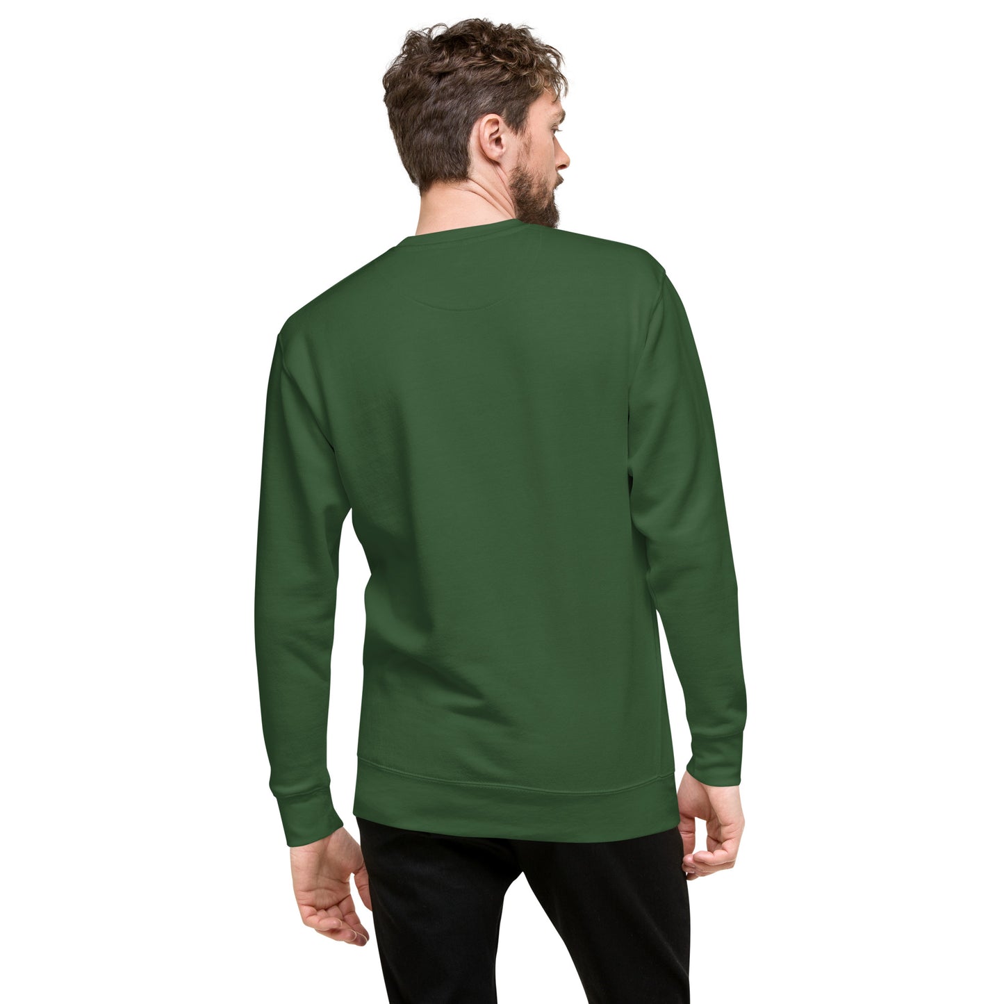 Man wearing green sweatshirt with pumpkin flying on broom Halloween design.