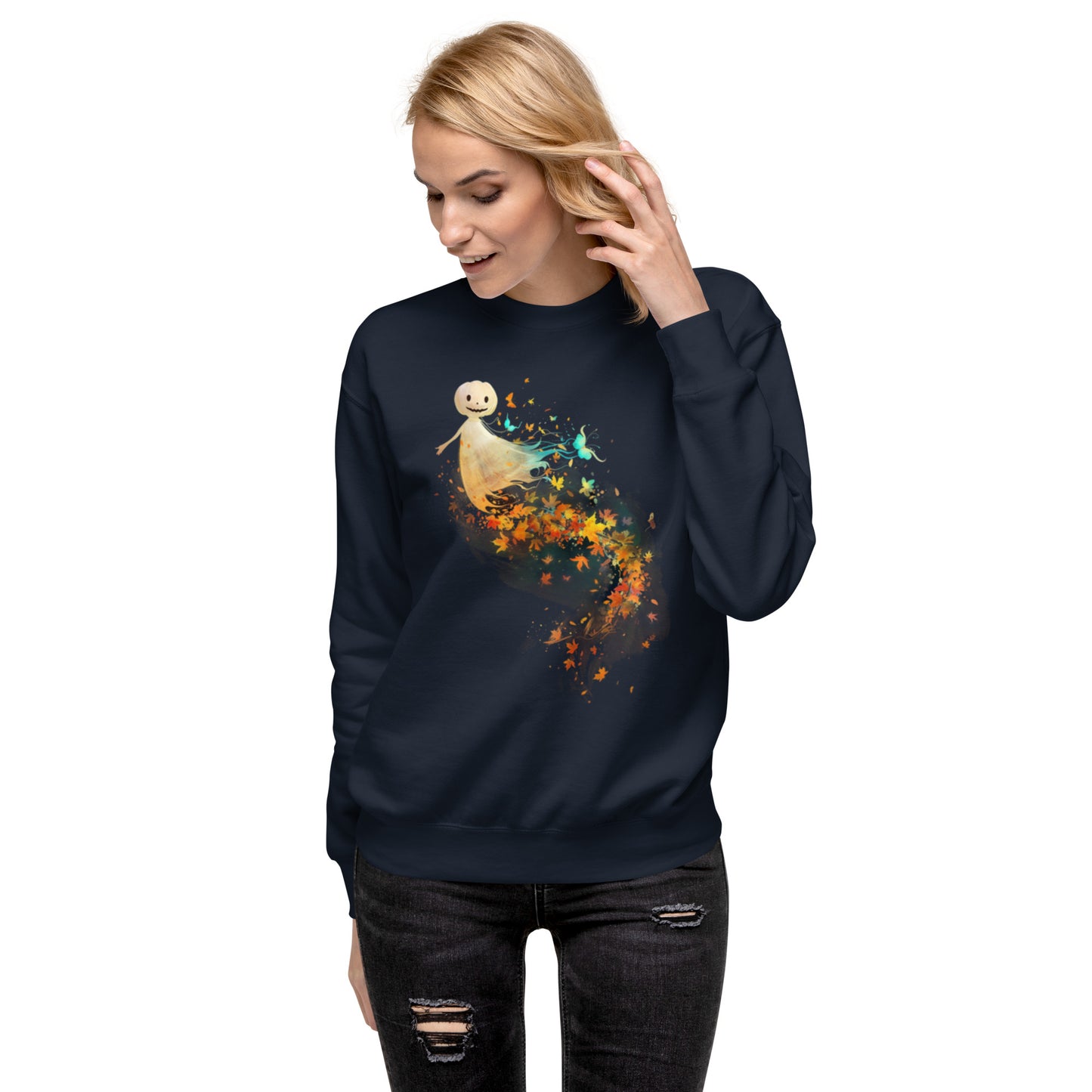Woman wearing navy sweatshirt with happy pumpkin ghost and autumn leaves Halloween design.