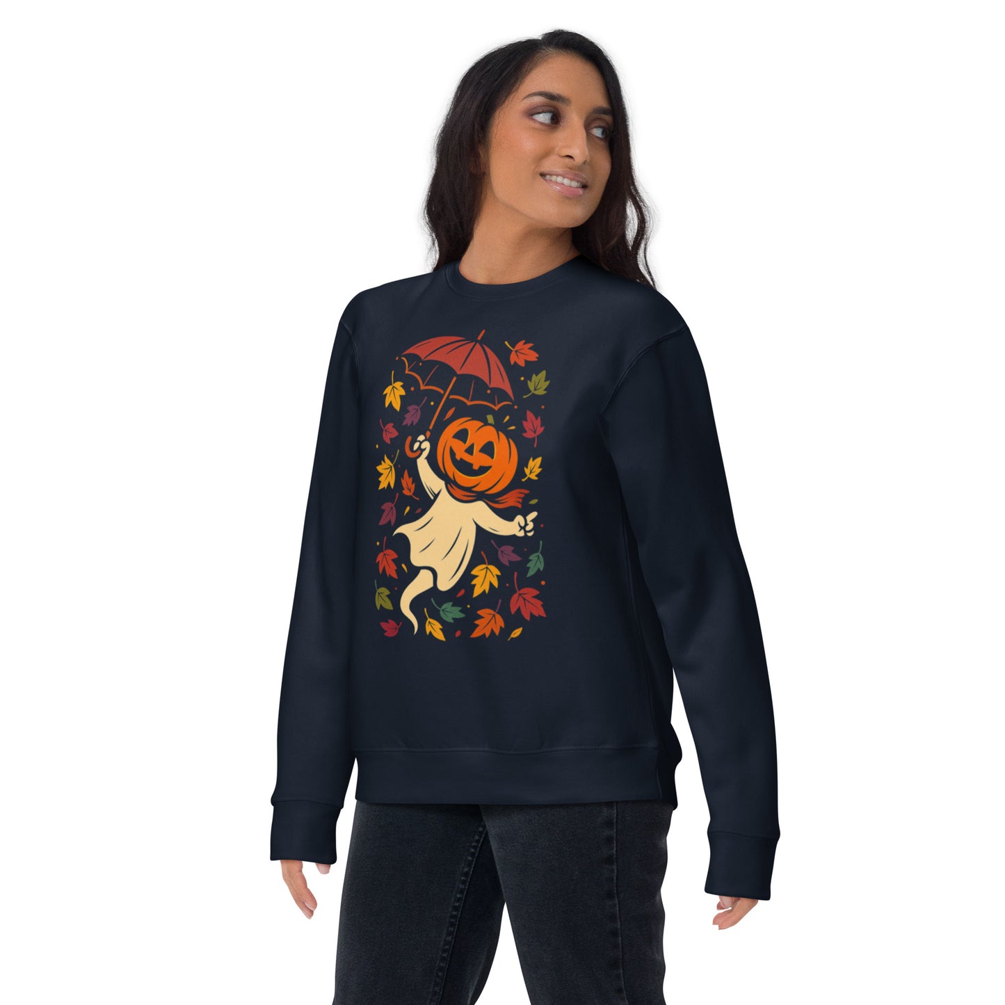 Woman wearing navy sweatshirt with pumpkin ghost and umbrella Halloween design.